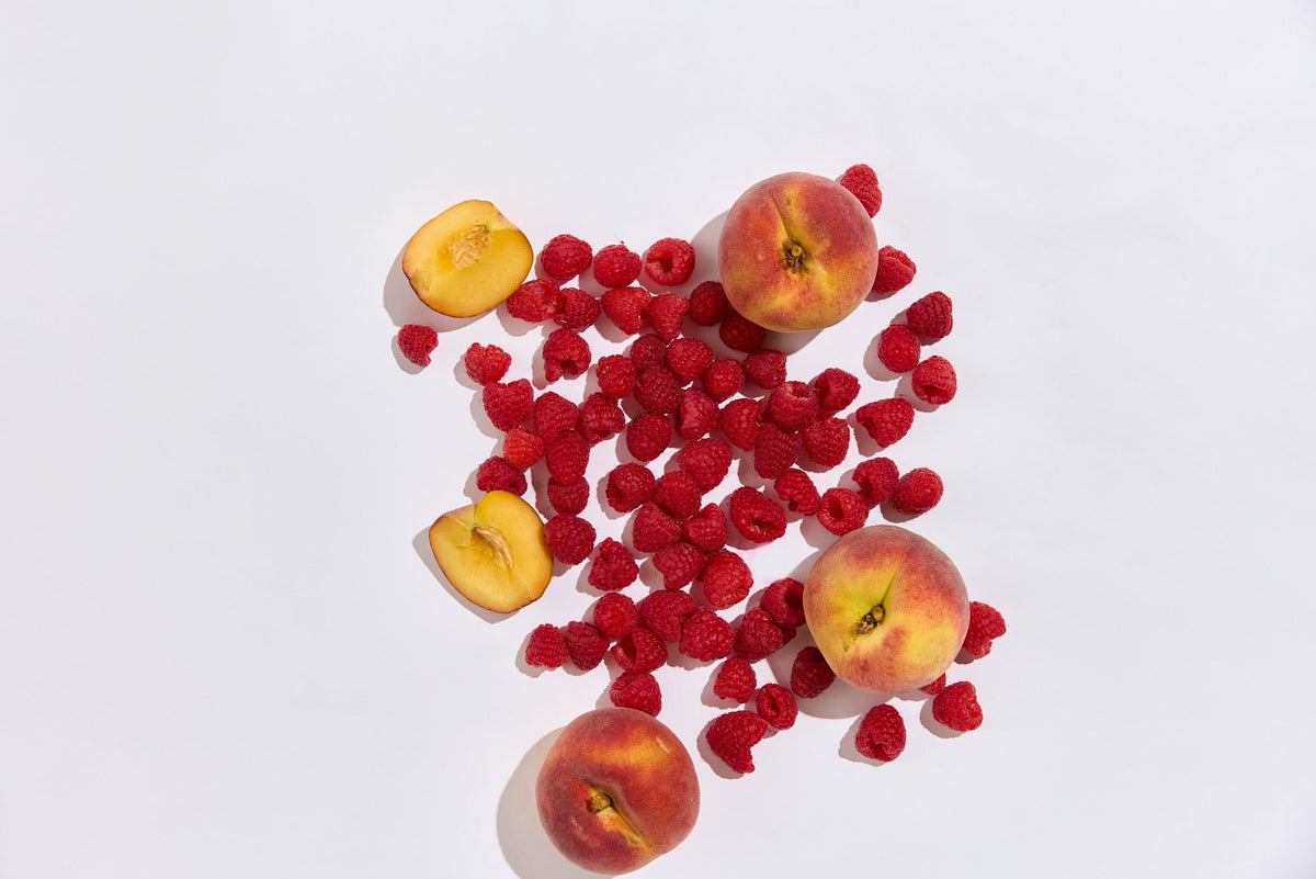 Fresh peaches and raspberries representing the Daily Meno flavour